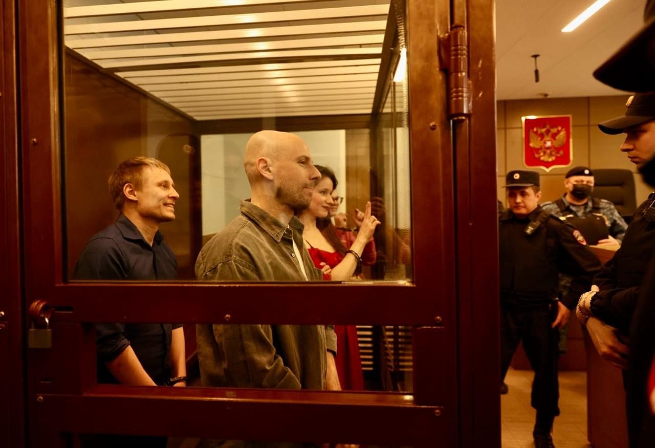 Left to right: journalists Konstantin Gabov, Sergey Karelin, and Antonina Favorskaya during sentencing on April 15. Artyom Kriger is seen behind them.