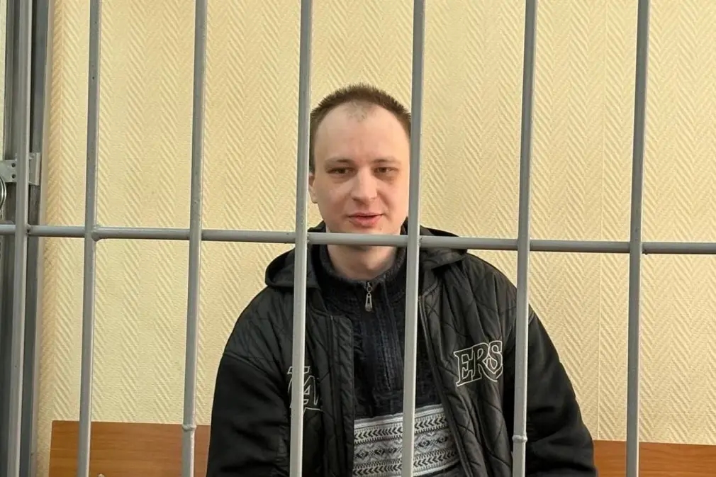 U.S. citizen and ex-Marine Robert Gilman pictured in a courtroom holding cell in Russia. Photo: RIA Voronezh