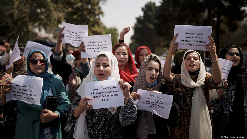 Women gather to demand their rights under the Taliban rule during a protest in Kabul, Afghanistan