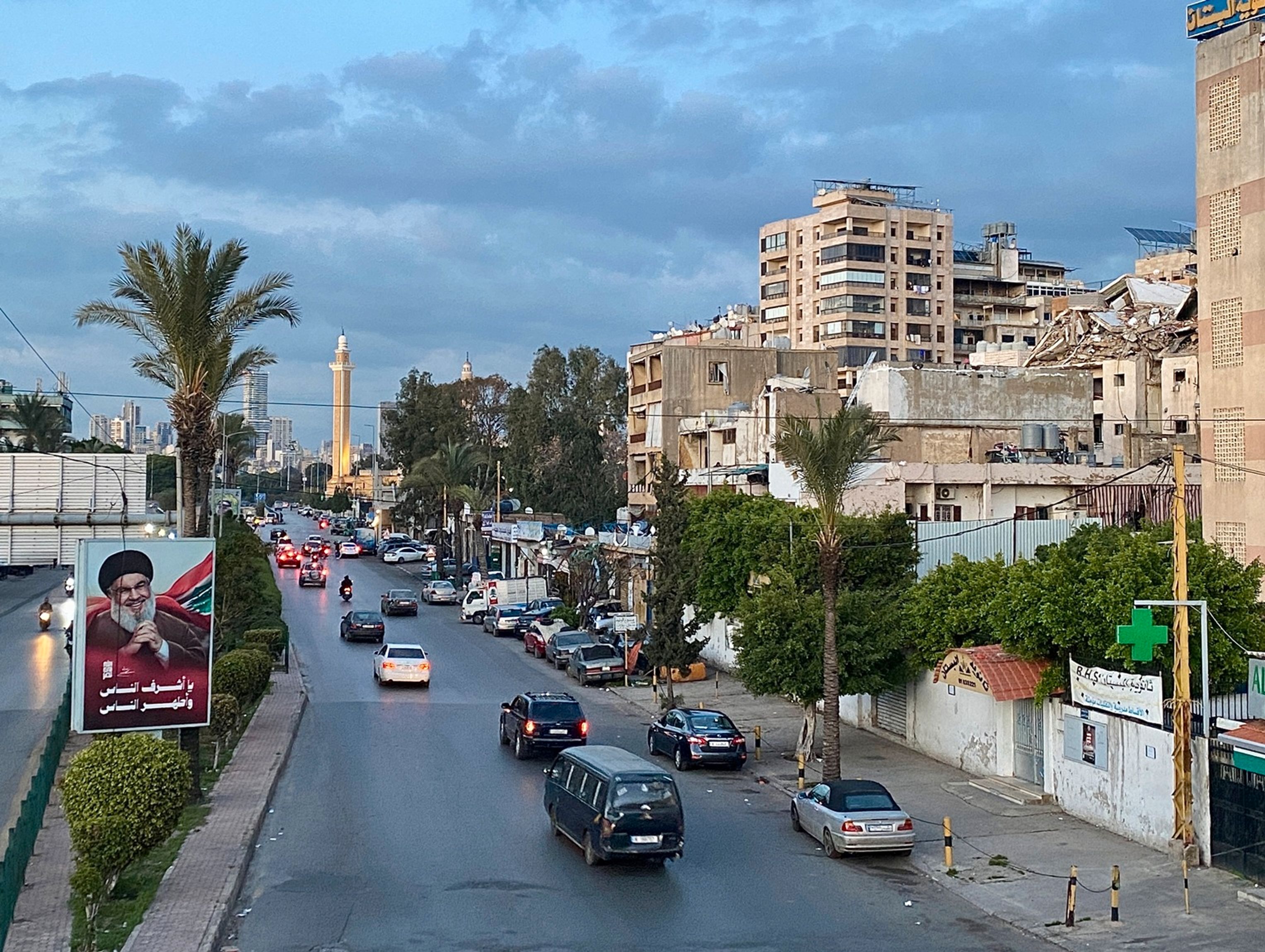 Beirut's suburb of Dahieh. On the left, buildings destroyed by Israeli airstrikes; on the right, a portrait of former Hezbollah leader Hassan Nasrallah
