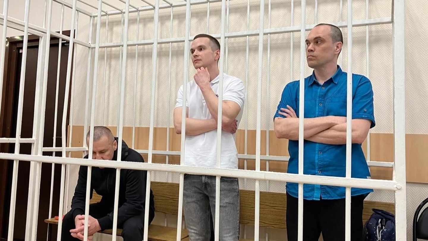 Alexei Navalny's lawyers Igor Sergunin, Alexei Liptser, and Vadim Kobzev in a courtroom holding cell